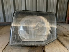 Faro anteriore SX Mitsubishi Pajero anno 2000