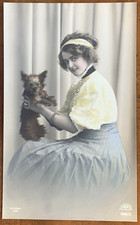 Woman Holds Yorkshire Terrier