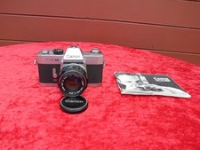 Canon EX Auto QL con obiettivo