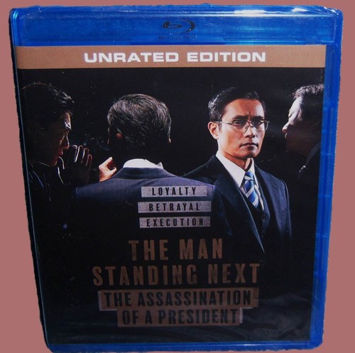New the man standing next - the,