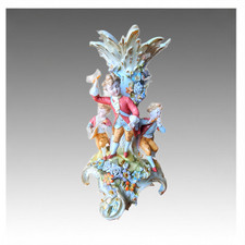Antico candelabro statuina