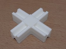 Connettore a " X " in plastica