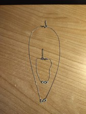 Collana e braccialetto con simbolo infinito