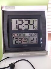 Orologio da parete con termometro interno ed esterno e simbolo previsione meteo