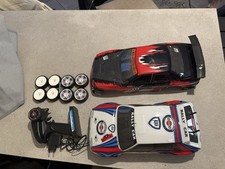 Macchinina RC elettrica + scocca e 2 set ruote