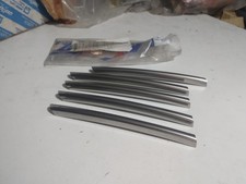 KIT BAFFI MASCHERINA GRIGLIA RADIATORE PER FIAT CROMA 85-90 ORIGINALE 82412014