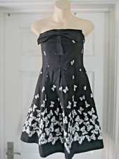 Abito senza spalline farfalla