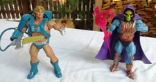 Motuc Club Eternia 2015 Exclusive Laser Power He-Man & Laser Light Skeletor