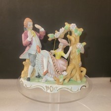 Antica statuina in ceramica di