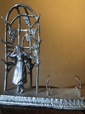 scultura metallo argentato