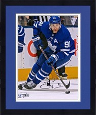Frmd John Tavares Maple Leafs Signed 8 x 10 Blue Jersey Skating with Puck Photo