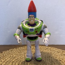Toy Story 25th Anniversary Buzz Lightyear Figura con Cintura Utilitaria Rocket Woody