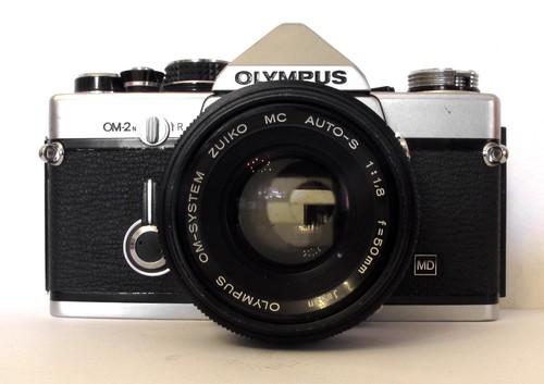 Olympus con obiettivo - con,