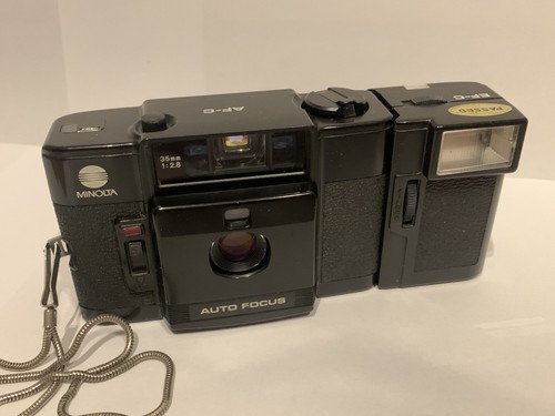 Minolta flash - +,