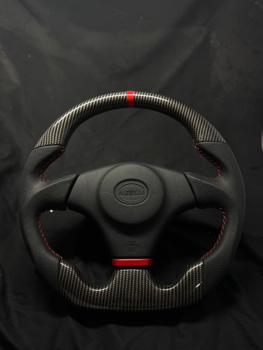 Volante fibra carbonio - in,