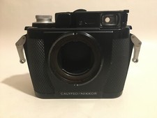 Calypso-Nikkor II + flash + custodie