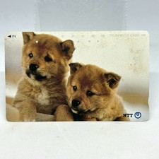 Scheda telefonica due cuccioli