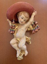 Antico putto con cappello