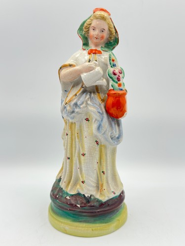 Antica statuina dama venditore