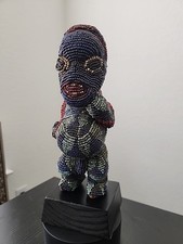 Statuina Mupo con perline