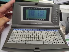 VINTAGE MINI COMPUTER ANNI 2000 TRADUTTORE VALUTE BORSA AZIONI TIMER SVEGLIA 64k