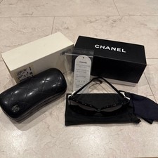 Occhiali da sole CHANEL fiocco nero RAP4829AA nastro bianco accessori ITALIA