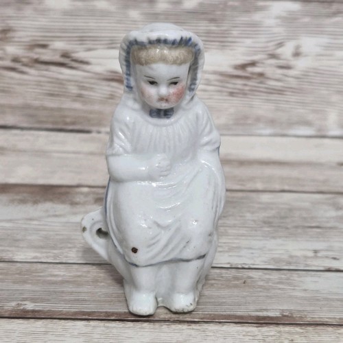 Antica statuina bambino vasino