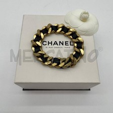 BRACCIALE CHANEL CATENA DORATA STRISCIA PELLE NERA