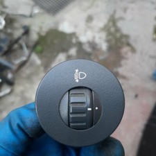 Pulsante regolazione fari su