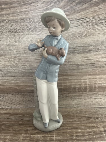 Nao lladro boy with dog - by,