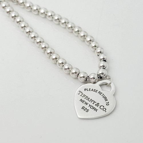Collana con ciondolo targhetta