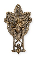 Coppia di putti in ghisa su