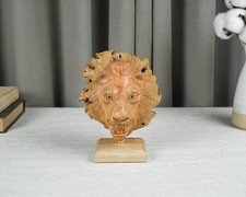 Scultura testa di leone in