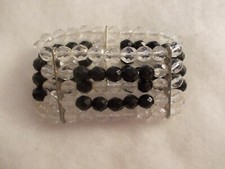 BRACCIALE MEZZI CRISTALLI NERI E TRASPARENTI