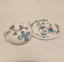 Teiera e piatto d'artigianato