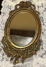 Antica cornice ovale in bronzo