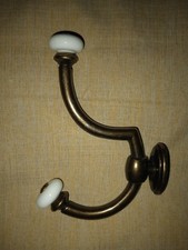 Antico doppio gancio in ottone