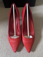 Scarpe corte con tacco rosso