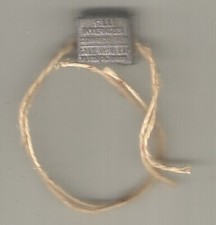 Sigillo piombo cm. 1,2x1, Cornaredo F.lli Invernizzi, 49SB/84/XII, sale, latte..