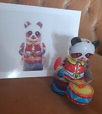 Andy Warhol - foto colori e giocattolo latta giapponese panda con tamburo 1983