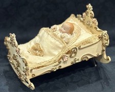 Antico lettino culla a dondolo