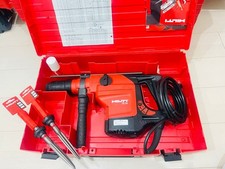 Trapano a percussione rotativo