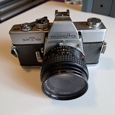 MACCHINA FOTOGRAFICA VINTAGE MINOLTA SRT 101 + OBIETTIVO28 MM E FILTRI VARI