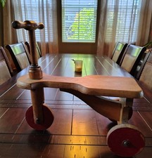 Triciclo giocattolo in legno