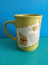 "LINDT" Tazza alta, disegno "Gold Bunny", porcellana, colore verde, h. 11 cm.