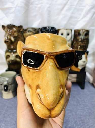 Vaso statuina testa bicchieri