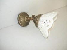 Applique in ottone brunito da