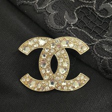 Spilla Chanel CC logo oro