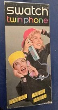 Telefono Swatch Twin phone (Modello Puzzle Pieces), nuovo, colore VIOLA AZZURRO.