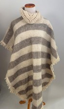 Poncho con frange pesanti